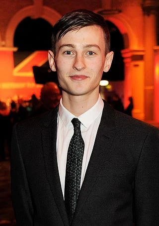 Elliott Tittensor headshot