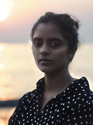 Kani Kusruti headshot