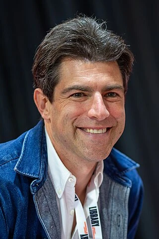Max Greenfield headshot