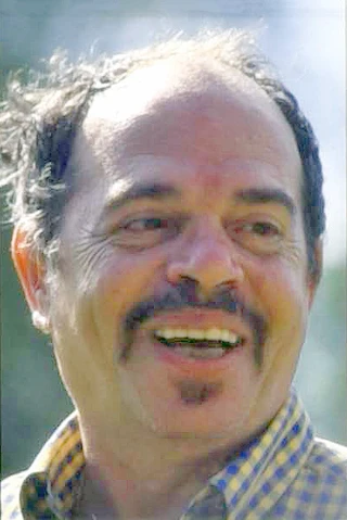 Ticky Holgado headshot
